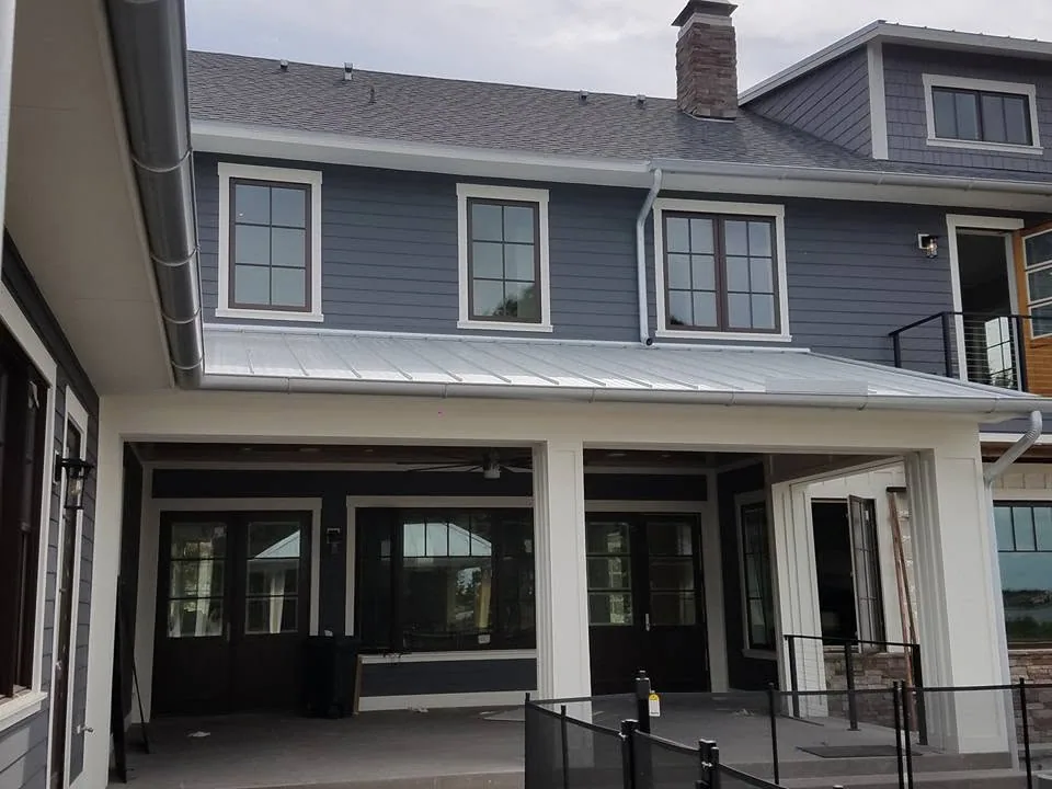 Slate blue lap siding standing seam porch roof galvanized downspouts, Sanford